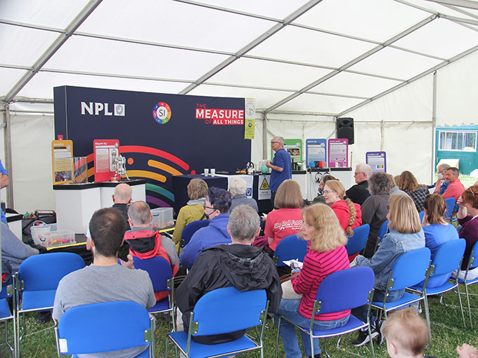 Andrew Hanson giving a workshop on importance of metrology to audience at NPL open day