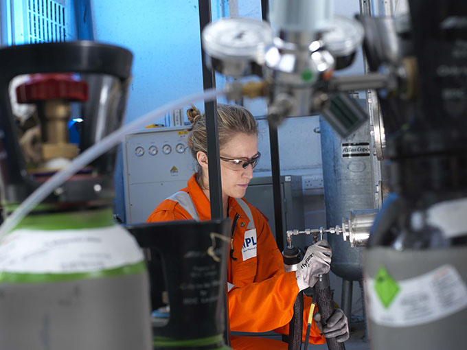 NPL staff worker working in lab